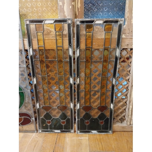 235 - Four early 20th C. leaded stained glass panels {104 cm H x 39 cm W and 94 cm H x 33 cm W}.