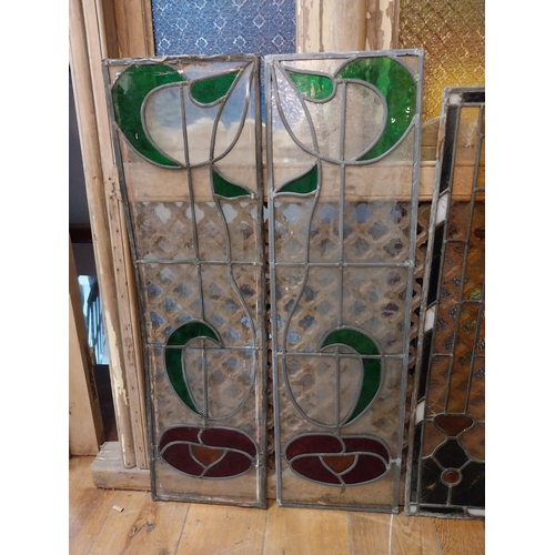 235 - Four early 20th C. leaded stained glass panels {104 cm H x 39 cm W and 94 cm H x 33 cm W}.