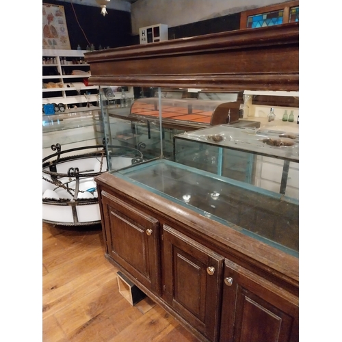 242 - Oak veneered and glass fish tank {134 cm H x 196 cm W x 53 cm D}.