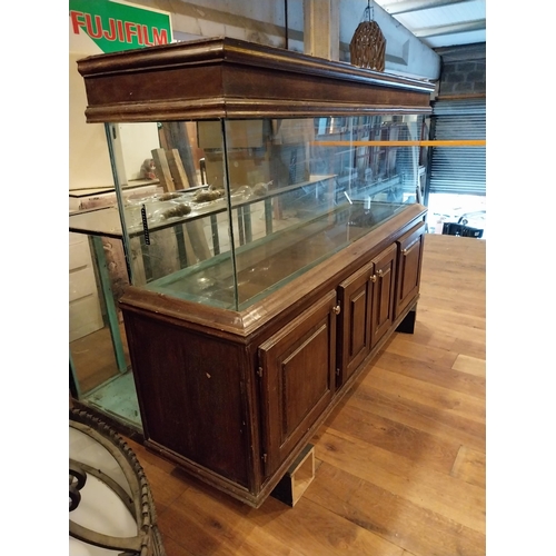 242 - Oak veneered and glass fish tank {134 cm H x 196 cm W x 53 cm D}.