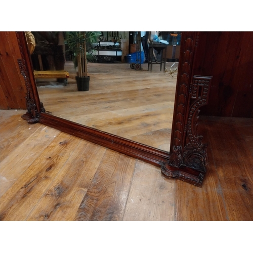 277 - Good quality carved mahogany wall mirror in the Victorian style {181 cm H x 140 cm W x 12 cm D}.