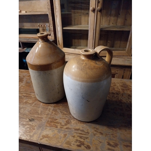 284 - Two early 20th C. glazed stoneware Whiskey flagons {40 cm H x 23 cm Dia. And 41 cm H x 22 cm Dia.}.