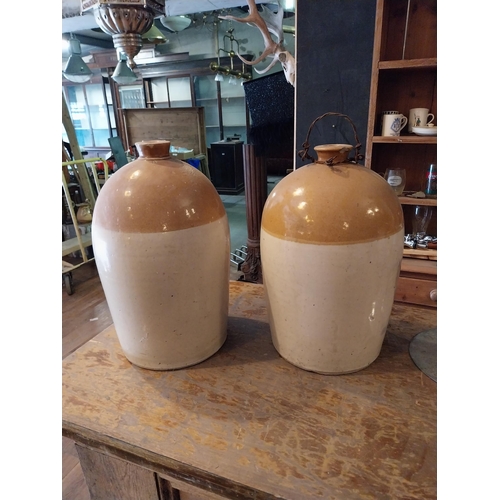 288 - Two early 20th C. glazed stoneware Whiskey jars {43 cm H x 27 cm Dia.}.