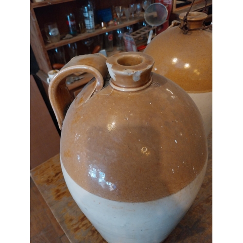 288 - Two early 20th C. glazed stoneware Whiskey jars {43 cm H x 27 cm Dia.}.