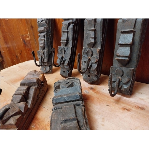 294 - Collection of six carved hardwood wall mounted coat hangers {Approx. 20  cm H x 8 cm W x 9 cm D}.