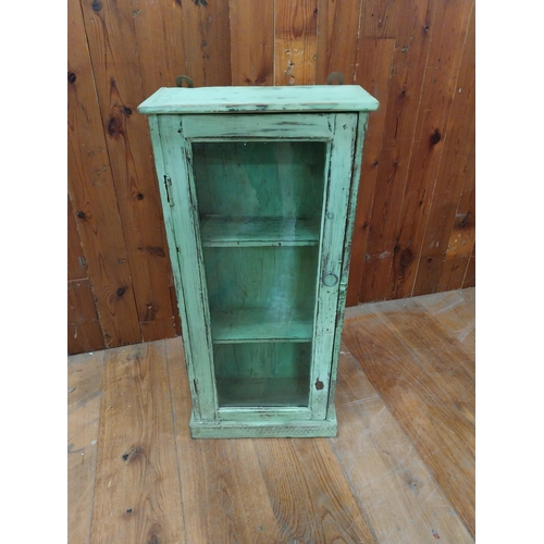 296 - Painted hardwood wall cabinet with single glazed door {83 cm H x 38 cm W x 18 cm D}.