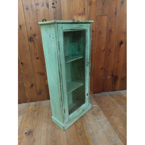 296 - Painted hardwood wall cabinet with single glazed door {83 cm H x 38 cm W x 18 cm D}.