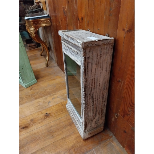 297 - Painted hardwood wall cabinet with single glazed door {77 cm H x 38 cm W x 21 cm D}.