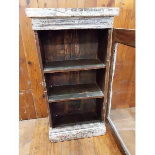 297 - Painted hardwood wall cabinet with single glazed door {77 cm H x 38 cm W x 21 cm D}.