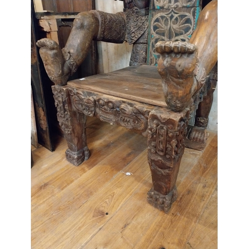 298 - Rare unusual heavily carved hardwood tribal throne chair {185 cm H x 94 cm W x 110 cm D}.