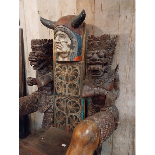 298 - Rare unusual heavily carved hardwood tribal throne chair {185 cm H x 94 cm W x 110 cm D}.