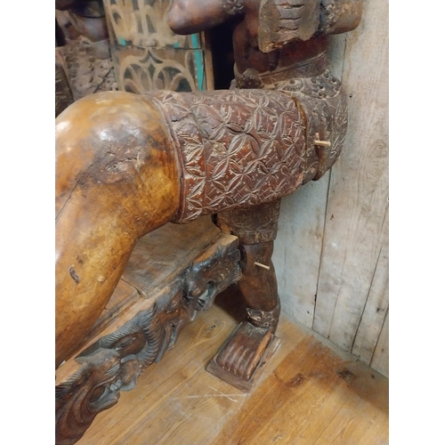 298 - Rare unusual heavily carved hardwood tribal throne chair {185 cm H x 94 cm W x 110 cm D}.