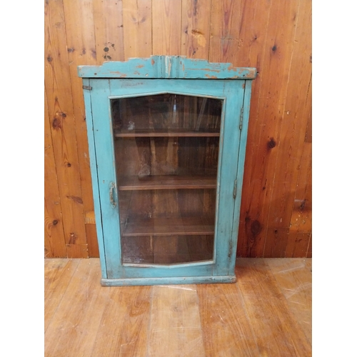 328 - Painted hardwood wall cabinet with single glazed door {98 cm H x 64 cm W x 20 cm D}.