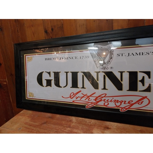 338 - Guinness coloured framed advertising print {38 cm H x 101 cm W}.