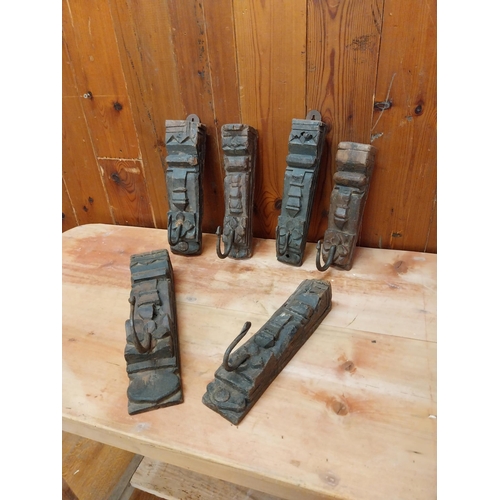 350 - Collection of six carved hardwood wall mounted coat hangers {Approx. 20  cm H x 8 cm W x 9 cm D}.