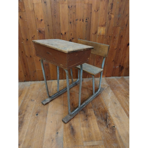 380 - 1950s oak and tubular metal school desk {86 cm H x 58 cm W x 77 cm D}.