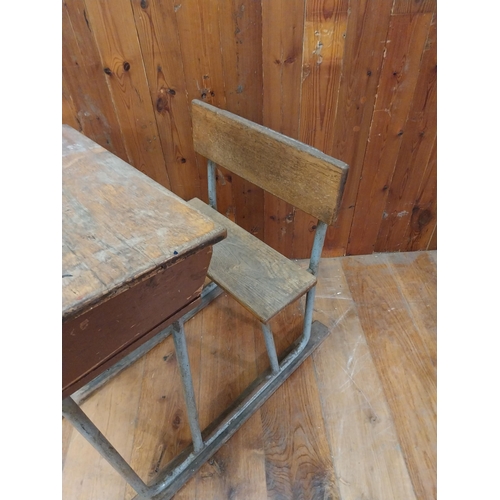 380 - 1950s oak and tubular metal school desk {86 cm H x 58 cm W x 77 cm D}.