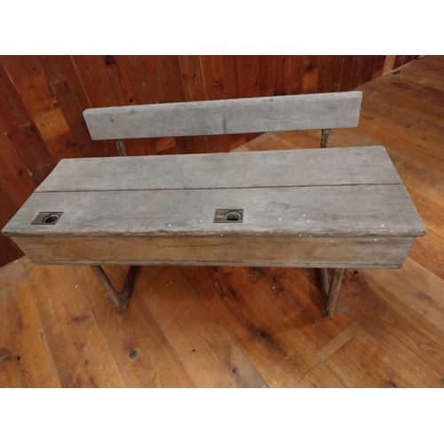 381 - 1950s oak and cast iron double school desk {63 cm H x 102 cm W x 63 cm D}.