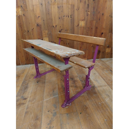 382 - 1950s pitch pine and cast iron double adjustable school desk {70 cm H x 102 cm W x 72 cm D}.