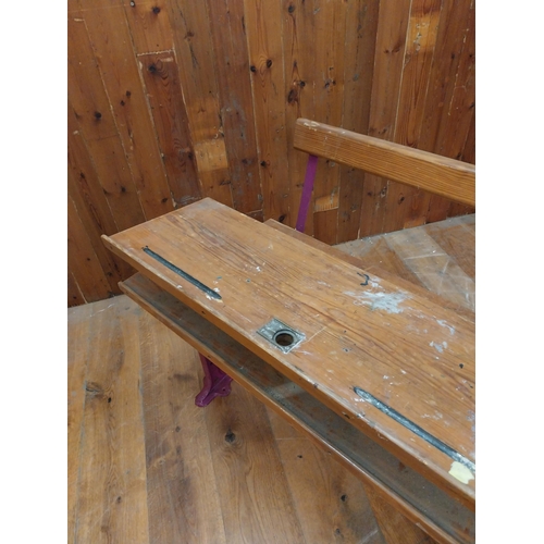 382 - 1950s pitch pine and cast iron double adjustable school desk {70 cm H x 102 cm W x 72 cm D}.