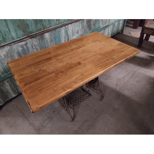 417 - Good quality pine pub table with cast iron singer sewing machine base {74 cm H x 120 cm W x 70 cm D}... 