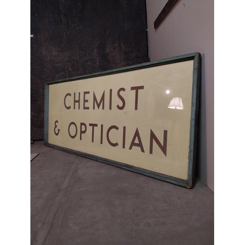 43 - Early 20th C. glass Chemist & Opticians sign mounted in pine frame originally from Disney Disenchant... 