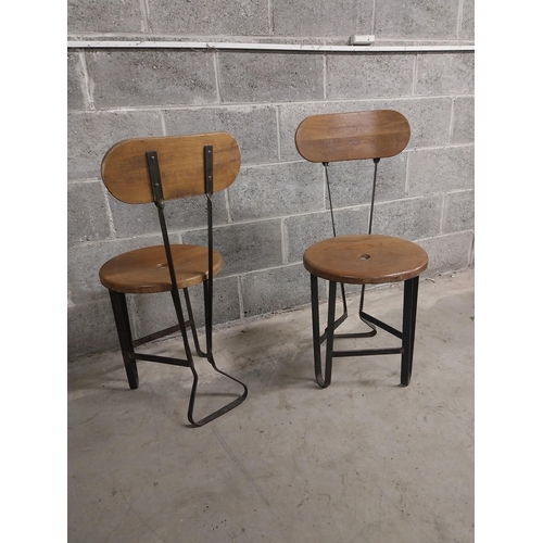 459 - Pair of bar - pub chairs with oak seats on wrought iron bases {86 cm H x 40 cm W x 43 cm D}.