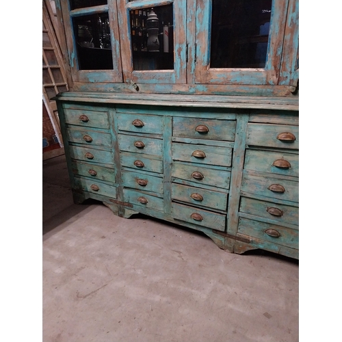 46 - Good quality painted hardwood shop cabinet with eight glazed doors above forty five bank of drawers ... 