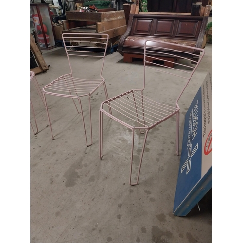 489 - Set of four painted metal chairs {83 cm H x 43 cm W x 52 cm D}.