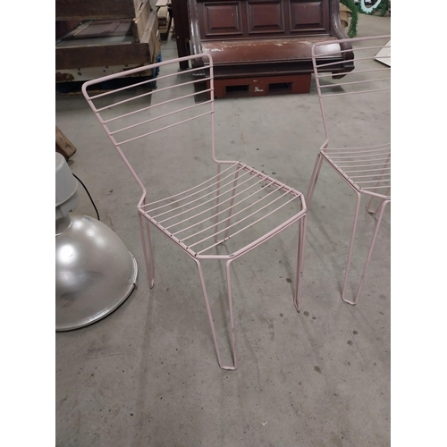 489 - Set of four painted metal chairs {83 cm H x 43 cm W x 52 cm D}.