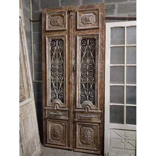 509 - Good quality pair of 18th C. painted pine doors with carved panels and wrought iron panels and bronz... 