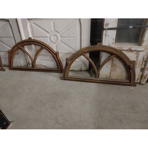 524 - Pair of good quality arched cast iron window frames {40 cm H x 72 cm W x 4 cm D}.