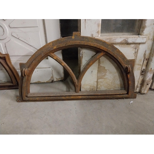 524 - Pair of good quality arched cast iron window frames {40 cm H x 72 cm W x 4 cm D}.