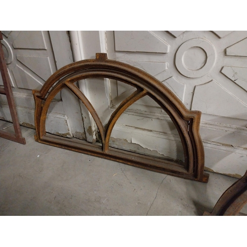 524 - Pair of good quality arched cast iron window frames {40 cm H x 72 cm W x 4 cm D}.