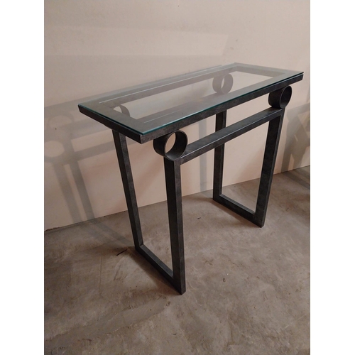 55 - Bronzed metal designer side table with glass top {78 cm H x 82 cm W x 36 cm D}.