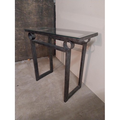 55 - Bronzed metal designer side table with glass top {78 cm H x 82 cm W x 36 cm D}.