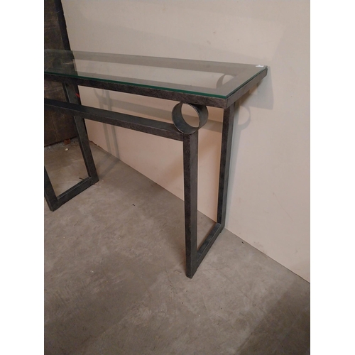 56 - Bronzed metal designer side table with glass top {78 cm H x 110 cm W x 35 cm D}.