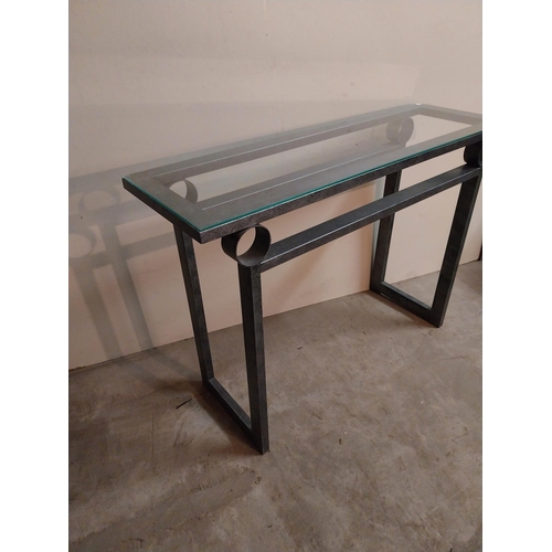 56 - Bronzed metal designer side table with glass top {78 cm H x 110 cm W x 35 cm D}.