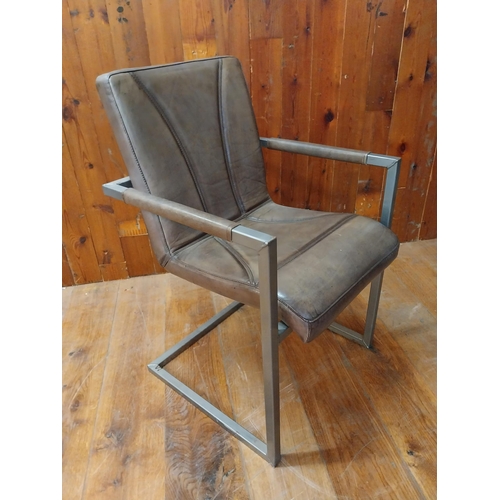 94 - Retro leather and steel armchair {77 cm H x 56 cm W x 55 cm D}.