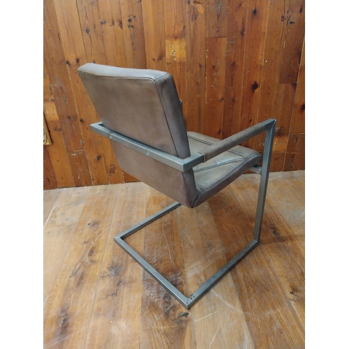 94 - Retro leather and steel armchair {77 cm H x 56 cm W x 55 cm D}.