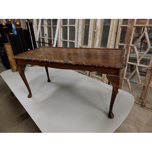 534 - 1950s mahogany coffee table raised on cabriole legs {47 cm H x 97 cm W x 48 cm D}.