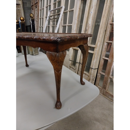 534 - 1950s mahogany coffee table raised on cabriole legs {47 cm H x 97 cm W x 48 cm D}.