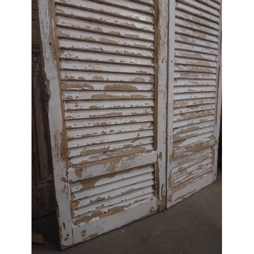 538 - Pair of 19th C. Louvre pine window shutters {150 cm H x 113 cm W x 5 cm D}.