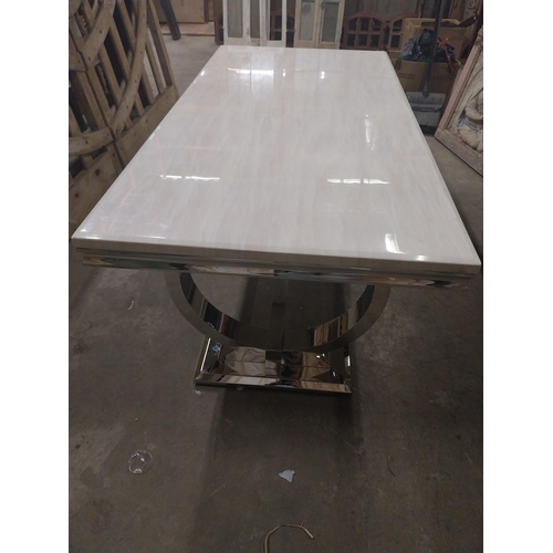 541 - Designer chrome table with marbleised top {78 cm H x 200 cm W x 100 cm D}.