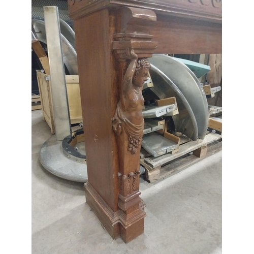 547 - Unusual French wooden chimney piece decorated with Cherubs {115 cm H x 301 cm W x 38 cm D}.