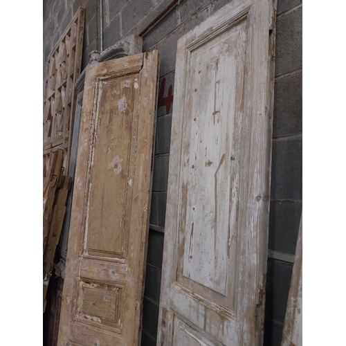 548 - Pair of 19th C. distressed pine doors {239 cm H x 55 cm W x 5 cm D}.