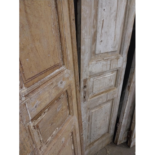 548 - Pair of 19th C. distressed pine doors {239 cm H x 55 cm W x 5 cm D}.