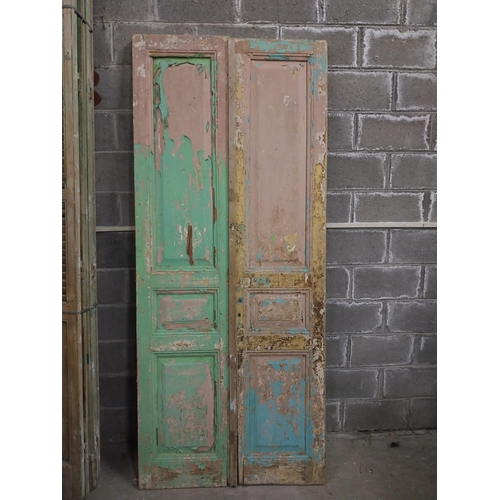 551 - Pair of 19th C. distressed pine doors with raised panels {241 cm H x 50 cm W x 5 cm D}.