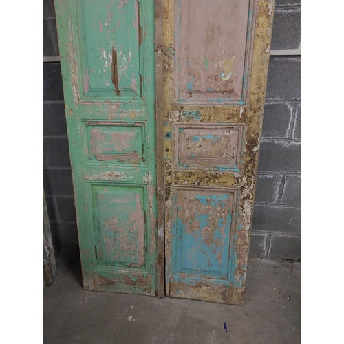 551 - Pair of 19th C. distressed pine doors with raised panels {241 cm H x 50 cm W x 5 cm D}.