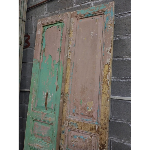 551 - Pair of 19th C. distressed pine doors with raised panels {241 cm H x 50 cm W x 5 cm D}.